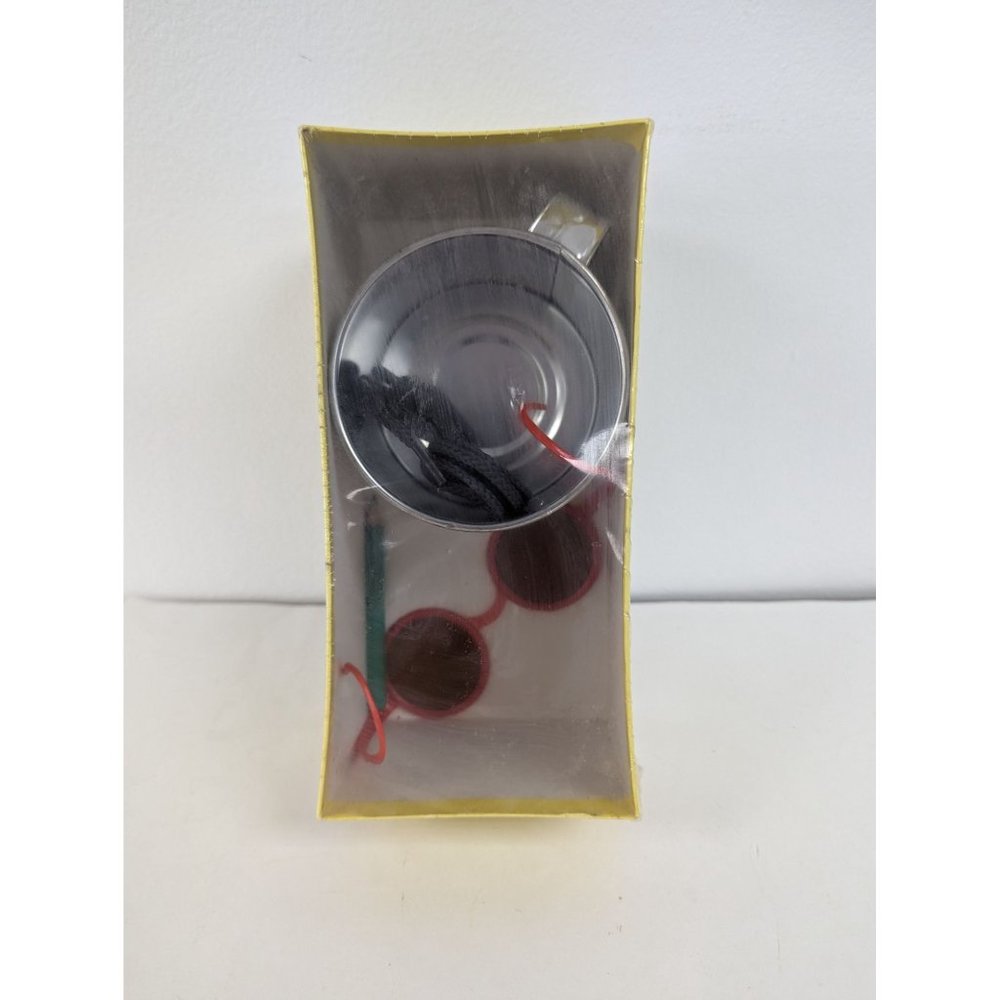 Box of Tin Cup Mug, Shoestrings, Small Sunglasses, Pencil